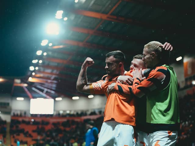 Dale Taylor celebrates his goal in Blackpool's victory over MK Dons