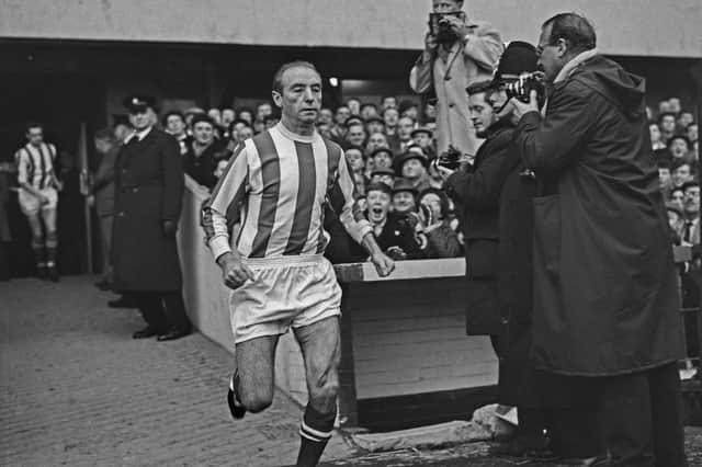 Stanley Matthews runs out at Stoke City's Victoria Ground for his final game in the Football League