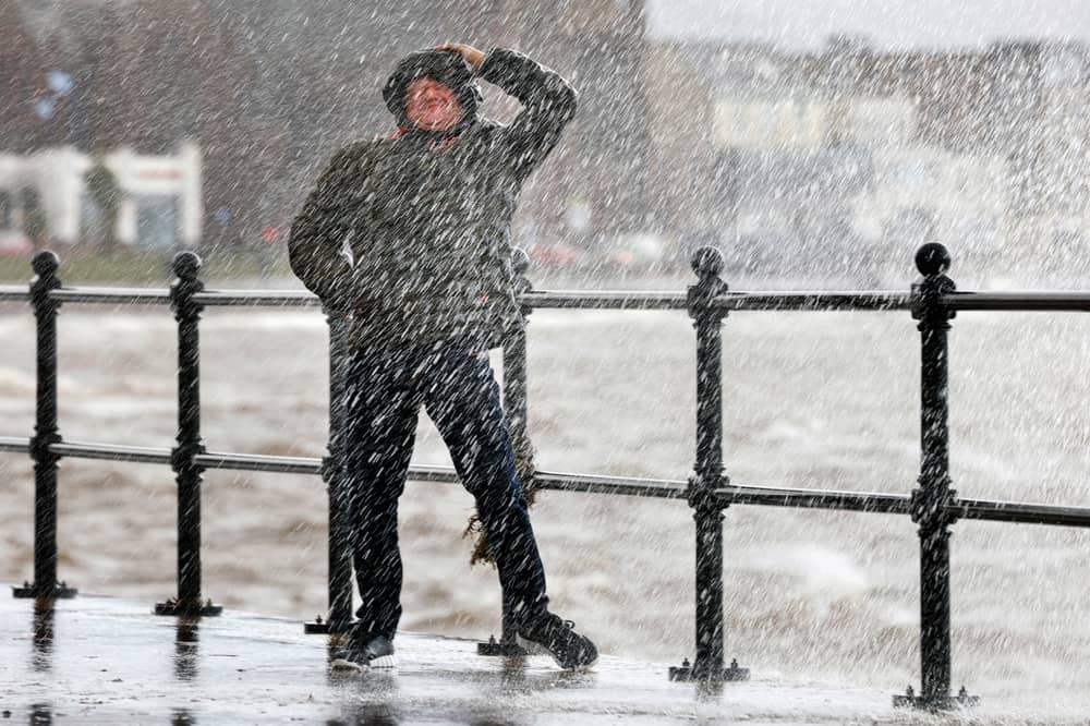 Waves crash over the promenade due to the affects of storm Boelo 