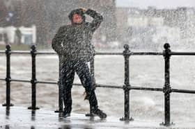Waves crash over the promenade due to the affects of storm Boelo 