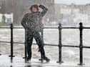 Waves crash over the promenade due to the affects of storm Boelo 