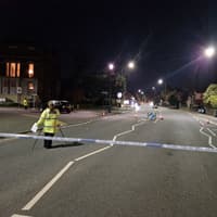 A main Wigan road has been closed after a motorcyclist was seriously injured in a collision