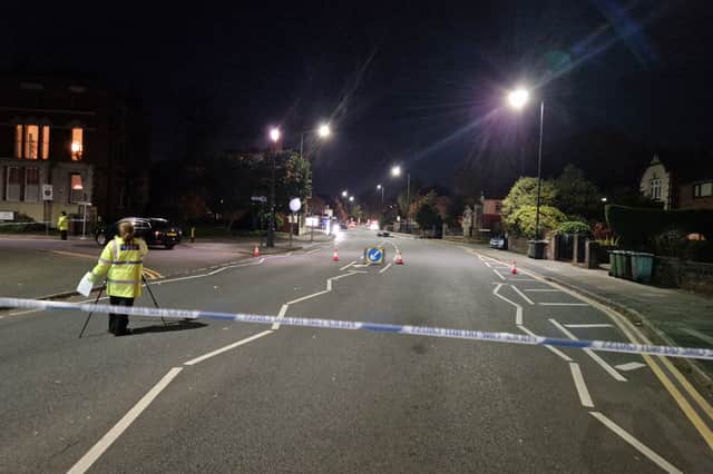 Wigan Lane this evening. A damaged motorbike remains in the middle of the road
