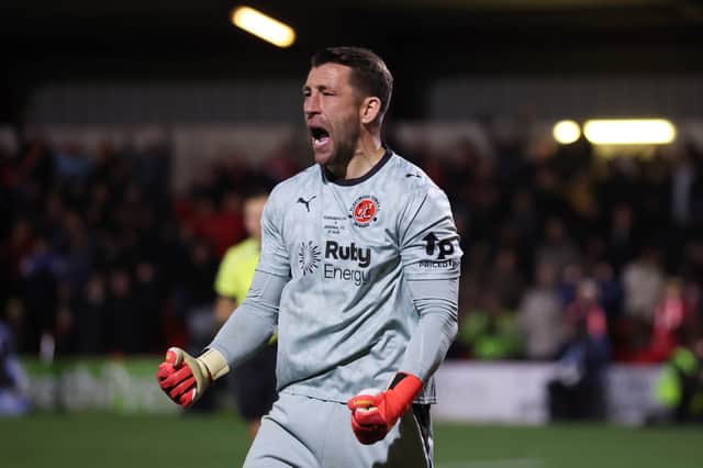 Fleetwood Town goalkeeper Jay Lynch celebrates his heroic penalty save