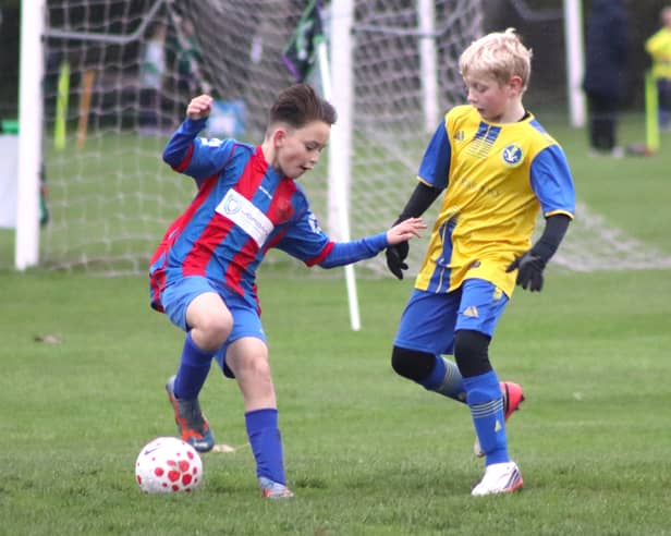 TM Sports Under-11s on the ball against Spirit of Youth Neos