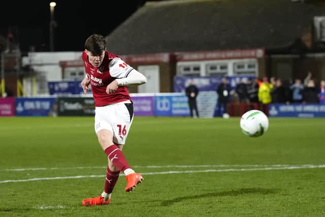 Fleetwood’s Conor Haughey slams home the decisive penalty in the shootout win over Arsenal