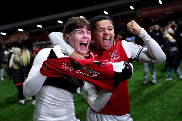 Penalty king Conor Haughey and Raffaele Cirino celebrate Fleetwood Town's cup upset over Arsenal at Highbury Stadium.