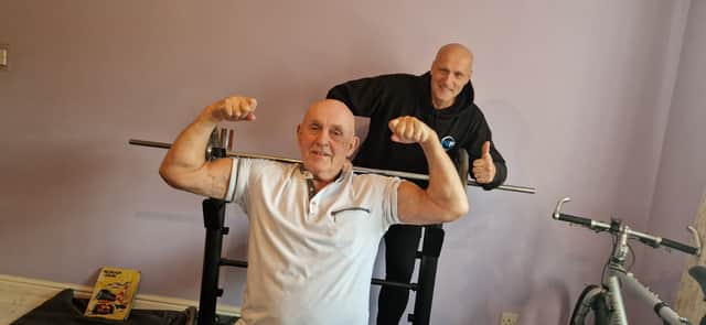 Former strongman Harry Kay who is still training at 80 with his neighbour Arron Hearsum. Picture: Lucinda Herbert