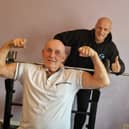 Former strongman Harry Kay who is still training at 80 with his neighbour Arron Hearsum. Picture: Lucinda Herbert
