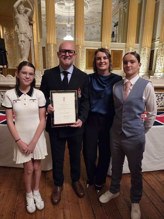 Scott Rogers with his family when he received the BEM in Liverpool