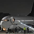 Photos taken by Dave Nelson show the Arsenal players boarding the aircraft following their shock loss to Fleetwood.