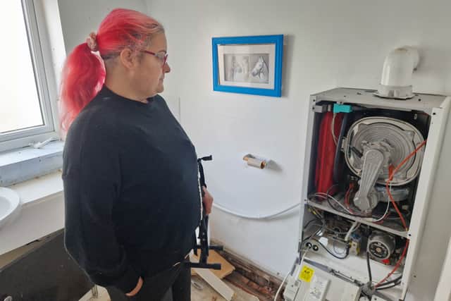 Sarah inspects the damage at her South Shore Pitstop Community Cafe 
