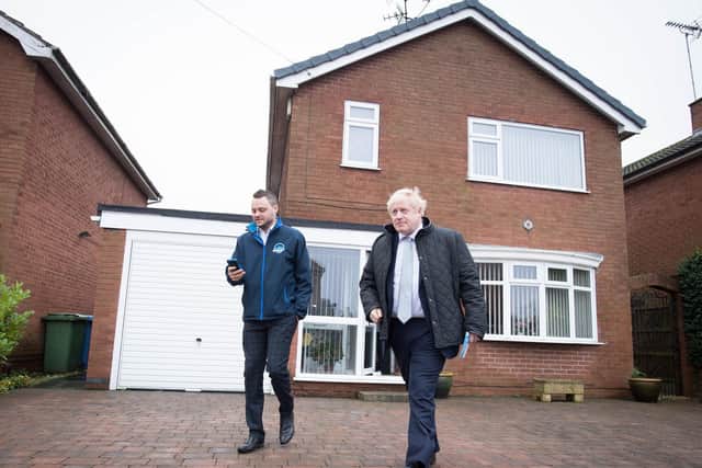 Prime Minister Boris Johnson, who has denied allegations the Conservatives offered peerages, door knocking in Mansfield, Nottinghamshire, whilst on the General Election campaign trail today (Picture: Stefan Rousseau/PA Wire)