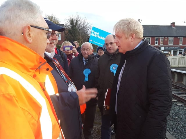 Boris Johnson speaking to volunteers at Thornton railway station