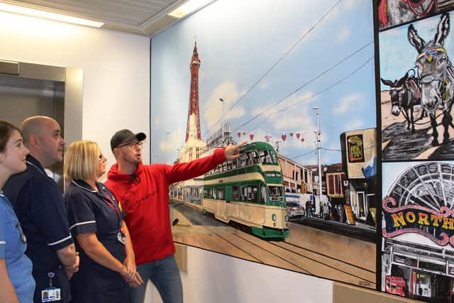 Adam and Blackpool Vic staff at the completed mural