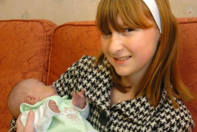 Pictured in 2007 - Jessica holding five-month old Harrison at the SCBU