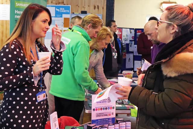 Guests visiting the stalls offering advice and support