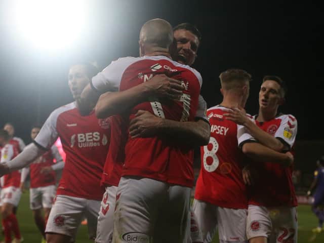 Ash Eastham celebrates Fleetwood's winner against Tranmere with scorer Paddy Madden