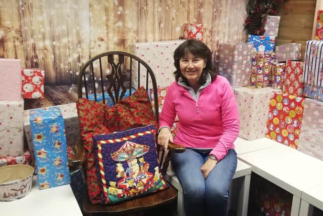 Linda Adams, owner of La Shack in Marsh Mill shopping village, in her Santa's grotto.
