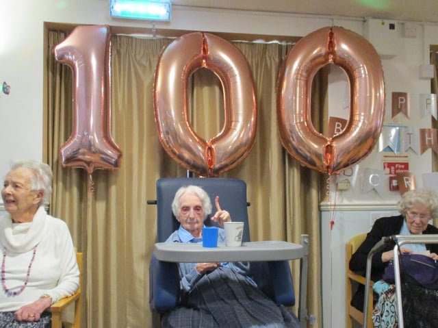 Doris Birkett celebrates with residents