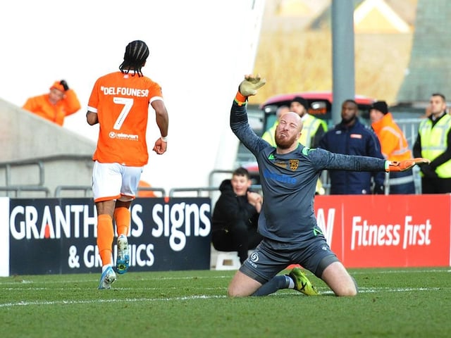 Nathan Delfouneso wheels away after scoring his second of the afternoon