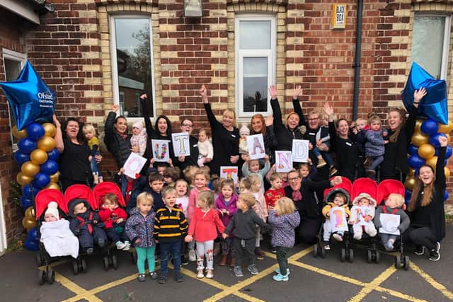 Staff and children at Poppy and Jacks celebrate the report