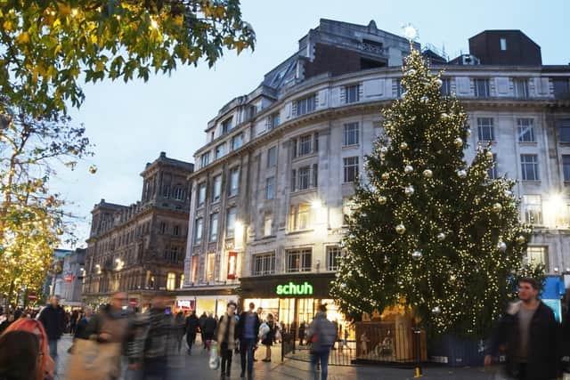 Shoppers and tourists posed for pictures in front of the brilliantly decorated Christmas tree - and nativity scene - in Church Street, right outside the Quest aparthotel (Picture: Michael Holmes/JPIMedia)