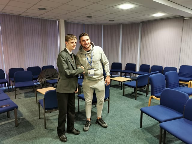 Coyle, right, paid a surprise visit to St George's School to apologise to ball boy Connor Turner