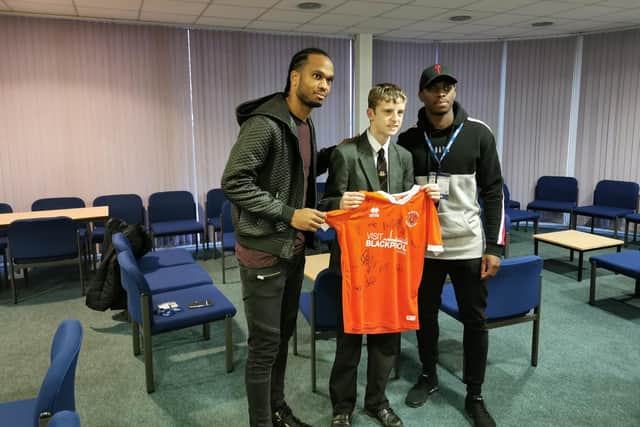 Nathan Delfouneso and Sullay Kaikai also presented Connor with a signed Blackpool shirt