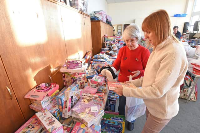 Volunteers sort out the presents at the Salvation Army's Raikes Parade HQ