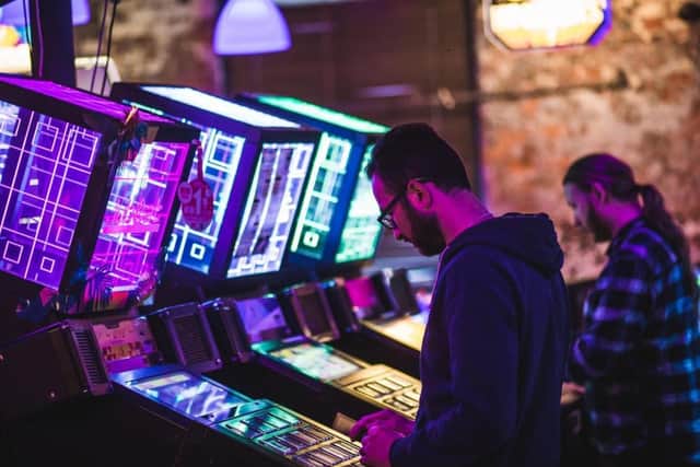 Gamers at one of Arcade Club's other venues