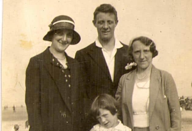 Little Una with her family on Blackpool beach in 1933.