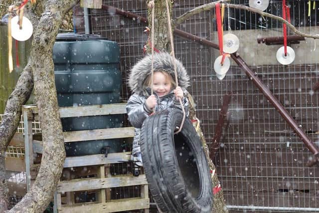 A youngster is full of smiles as she plays outdoors at the Little Explorers nursery, which became the first dedicated forestry school on the Fylde coast when it opened in 2016. It now plans to open its third branch in Poulton (Picture: Emma Rathbone/Little Explorers)