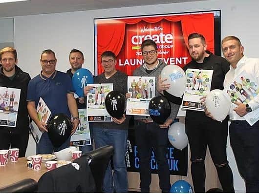 The team from Create Group with their charity calendars