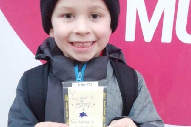 Tyler Millar with his handwritten ticket from bus driver Paul.