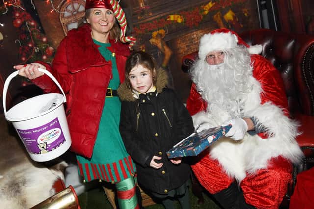 Michelle Nichol with six-year-old Alexis Coates and Father Christmas.