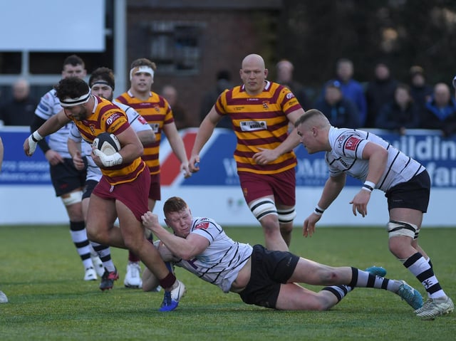 Fylde tryscorer Connor Wilkinson looks to make another break at Lightfoot Green