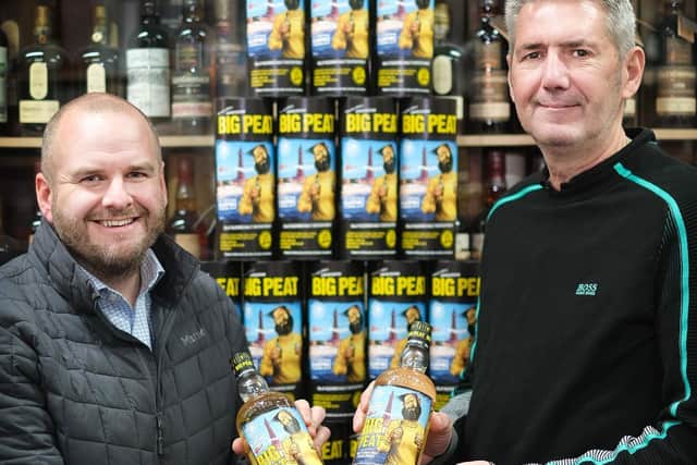 Tim Roberts and Wayne Ormerod of Whisky-Online in Charnley Rd, Blackpool, with their specially bottled edition of Big Peat whisky.