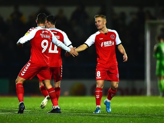 Kyle Dempsey (right) and Ched Evans celebrate Fleetwood's second goal at Rochdale