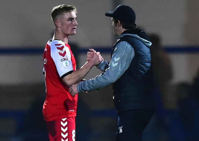 Kyle Dempsey and Joey Barton celebrate after victory at Rochdale