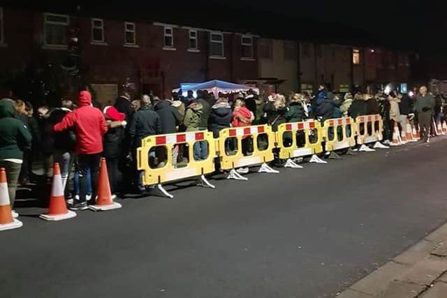 People queued along the street waiting for the lights switch-on.