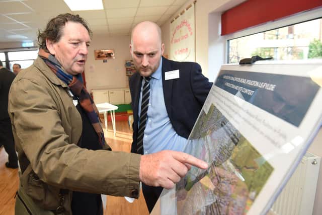 Local resident Graham Shaw talking to Adam Galleymore from Story Homes at the consultation event