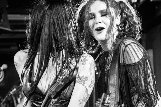 Bassist Jill Bethwaite, on the left, is known by her stage name Jilly Idol.