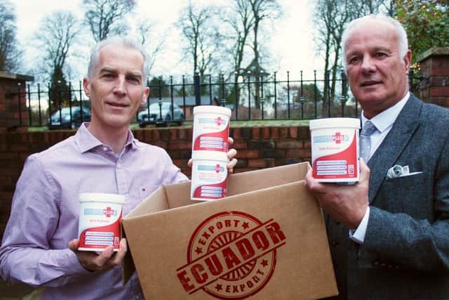 Keith Allum, left, of ArthoVite prepares to send his first export order of Collagen Plus to Ecuador, assisted by Les Ellaby-Blunt of the North and Western Lancashire Chamber of Commerce