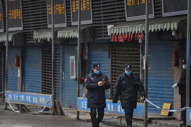 Police on the streets of Wuhan, in China