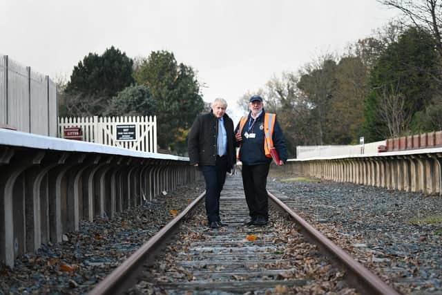 Prime Minister Boris Johnson (left) during a visit to Thornton-Cleveleys Railway Station, on the disused Fleetwood and Poulton-le-Fylde line while General Election campaigning.