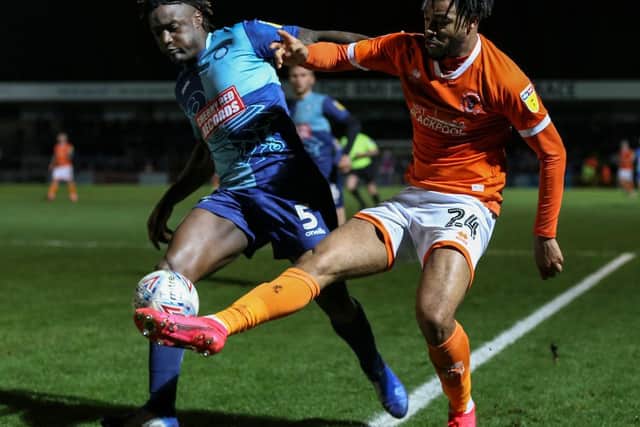 Blackpool's Joe Nuttall battles for the ball