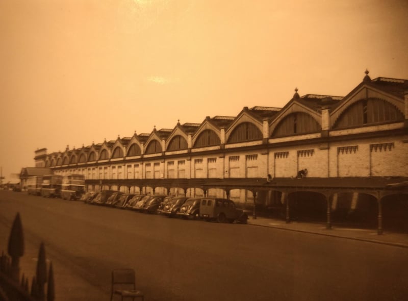 This photo is captioned onthe back as the new Queen Shelter which ran the length of the train station in Queens Terrace