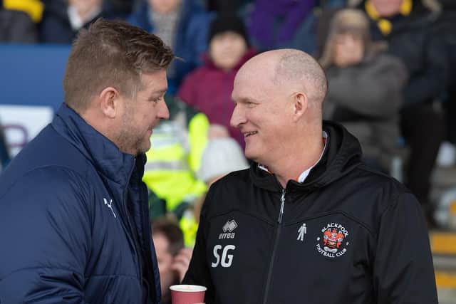 Oxford boss Karl Robinson with Simon Grayson before kick-off yesterday