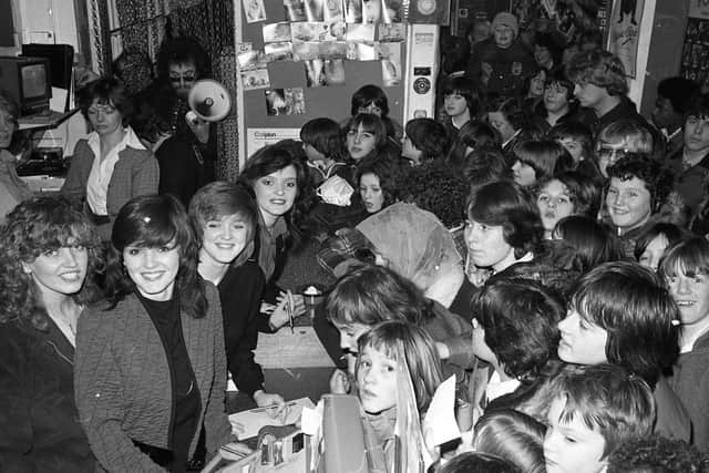 The Nolan Sisters take a break from performing in cabaret at Park Hall, in Charnock Richard to meet fans at record shop Malcolm's Musicland, in Chapel Street, Chorley on January 31, 1980